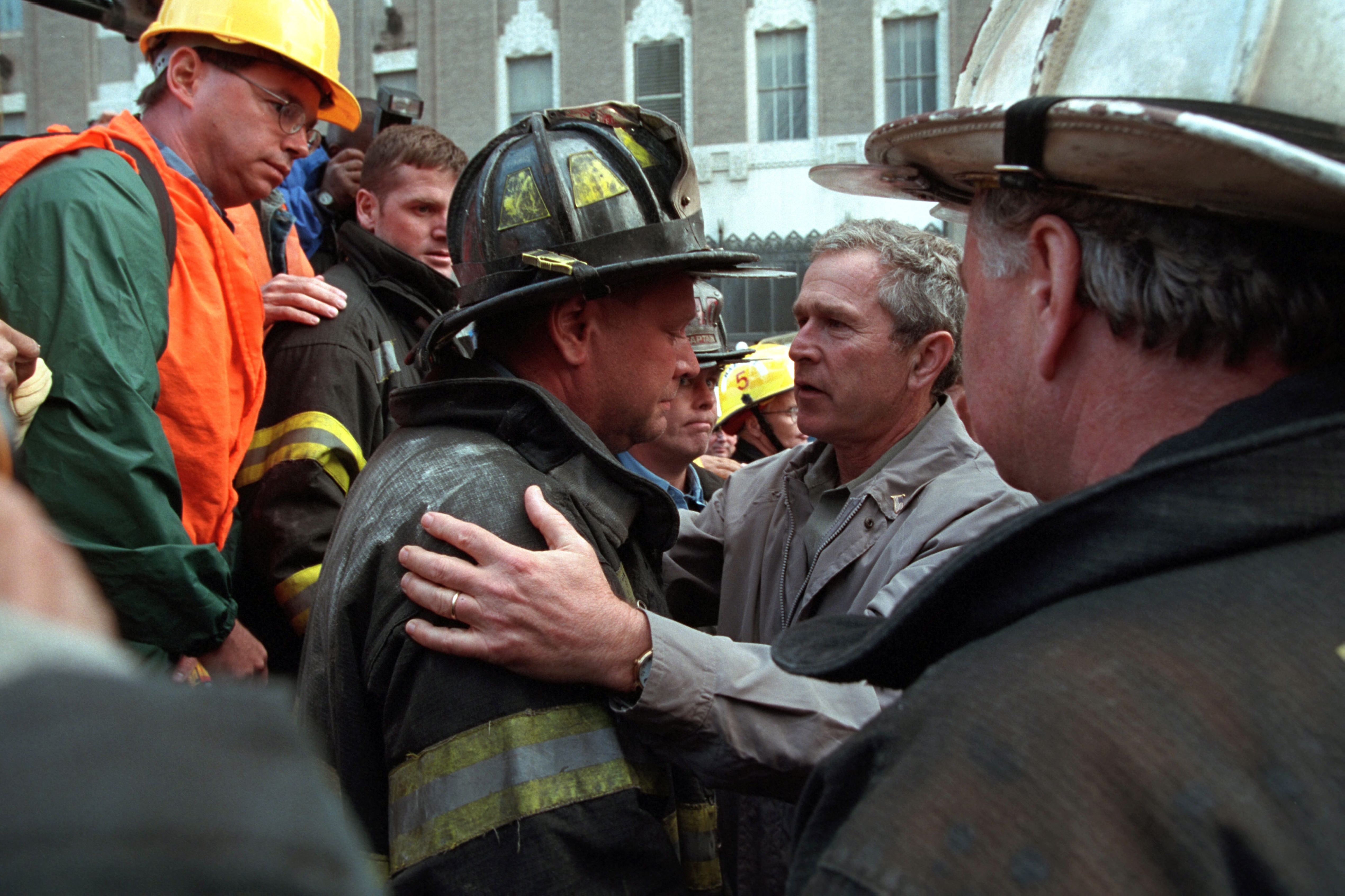 President Bush consoles firefighters and first responders at Ground Zero. George W. Bush Presidential Library.