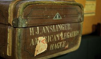 A brown suitcase that belonged to Harry J. Anslinger. 