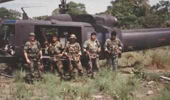 Agents in front of a helicopter