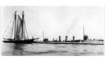 The U.S. Coast Guard Destroyer Terry flanking a French rum schooner