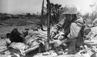 World War II medic treating a patient. United States Marine Corps.