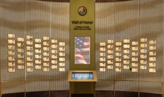 The new, brass DEA Wall of Honor with portraits of all fallen heroes. 