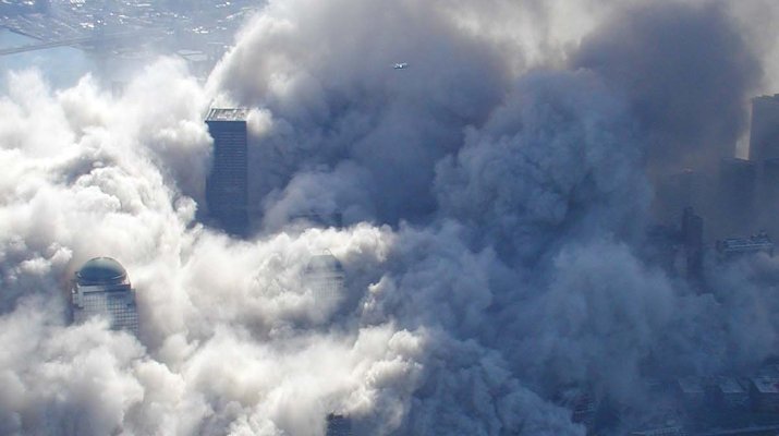 The toxic dust cloud enveloped lower Manhattan as the World Trade Center towers collapsed. National Archives.
