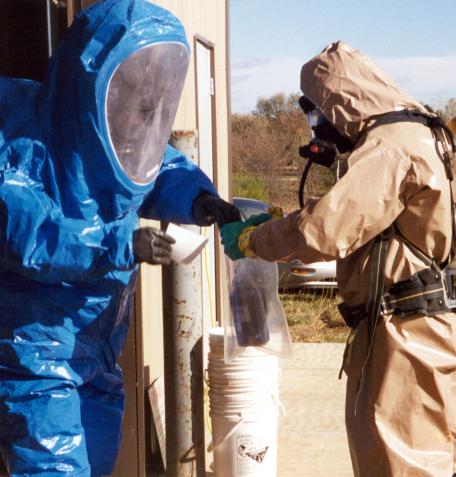 Two DEA chemists in protective gear