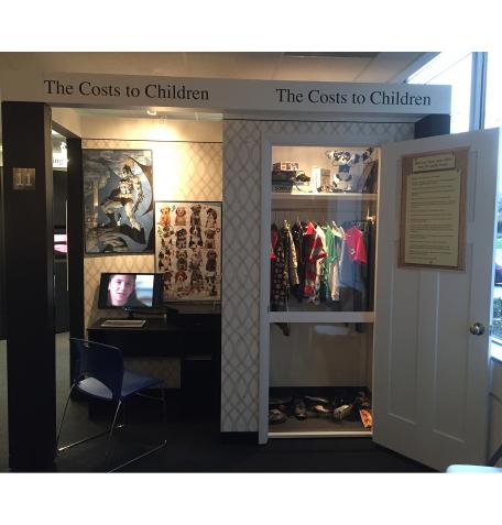 An exhibit featuring a child's bedroom closet and desk