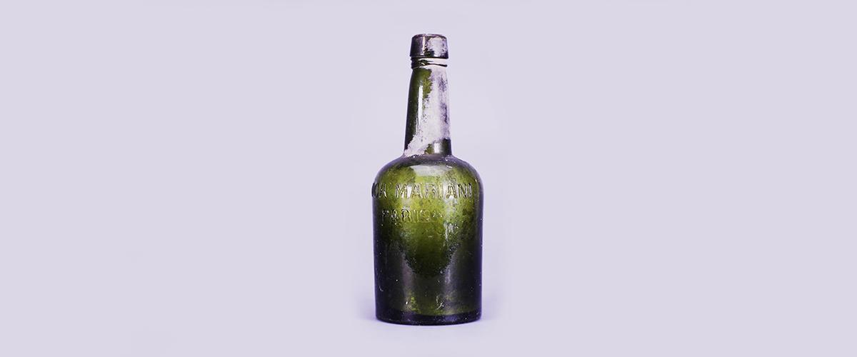 A green bottle that once contained Vin Mariani, a coca wine.