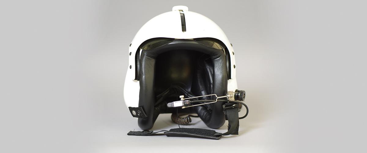   A white and black pilot helmet.
