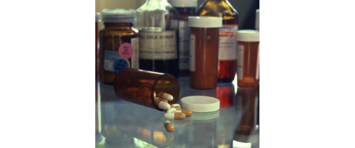 A bottle of pills spilled over