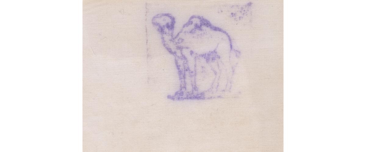 A blue camel-shaped stamp on fabric