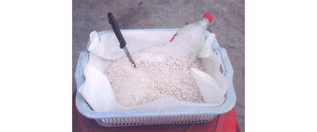 A container of dried, white heroin