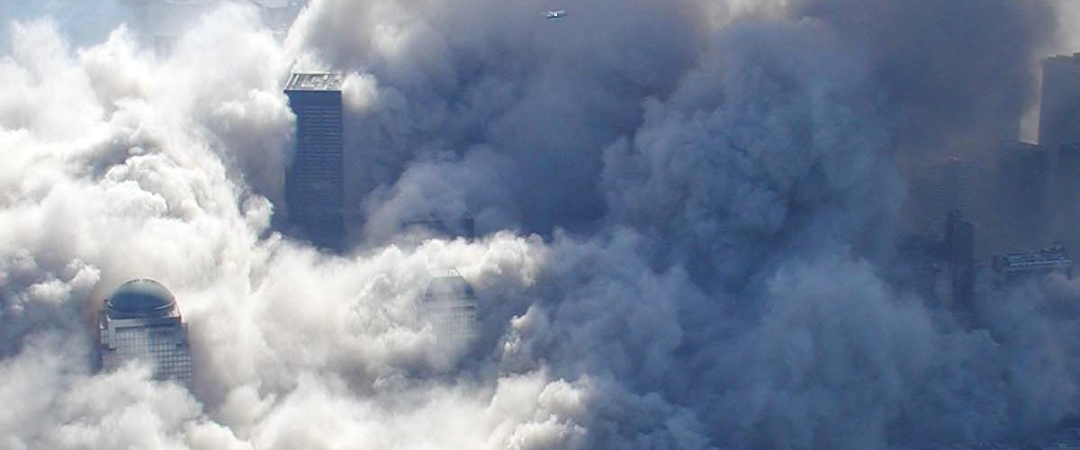The toxic dust cloud enveloped lower Manhattan as the World Trade Center towers collapsed. National Archives.