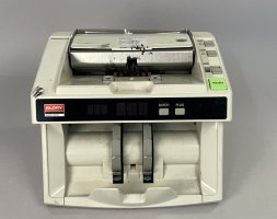 Beige plastic money counter with screen on front